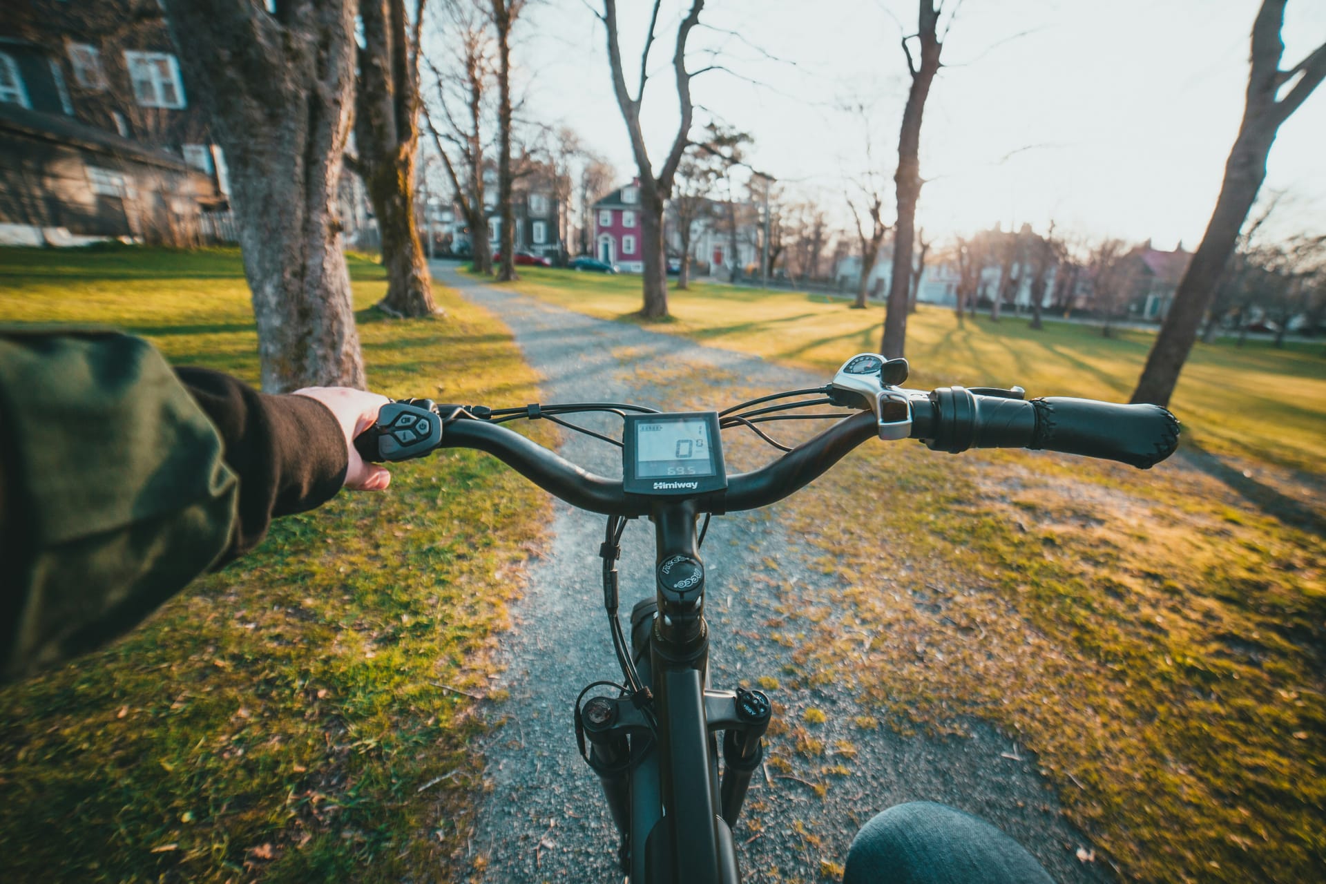ebike handlebar on countryside path at sunset